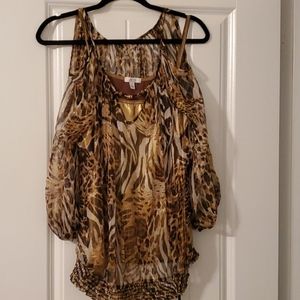 Be classy at the party in this animal print top